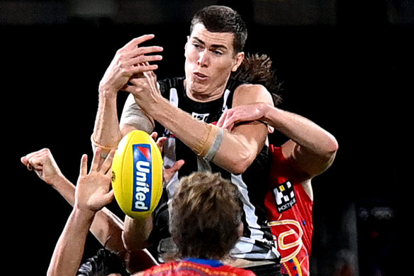 Cox flies for a mark against the Suns earlier this month.