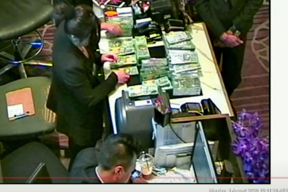 The NSW Bergin inquiry found that this footage of large amounts of cash being exchanged at Crown Melbourne was probably money laundering. 