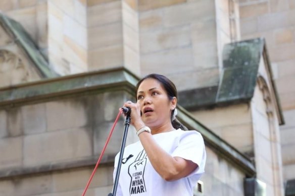 Myanmar-born Sydney businesswoman Sophia Sarkis addresses the 2000-strong crowd at the vigil on Saturday.