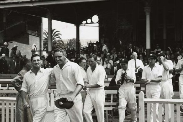 Fond farewell: Alan Davidson and Neil Harvey, playing in their final Tests, lead Australia onto the SCG during the 1962-63 Ashes.