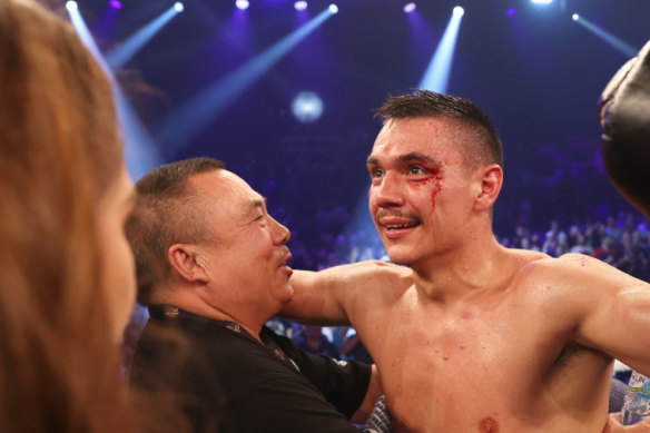 Tim Tszyu celebrates with his grandfather Boris after defeating Dennis Hogan in Newcastle.