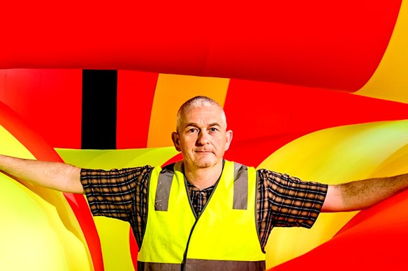 Michael Shaw with his latest work at Walsh Bay.