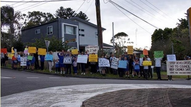 Residents protesting a boarding house gather in Cromer.