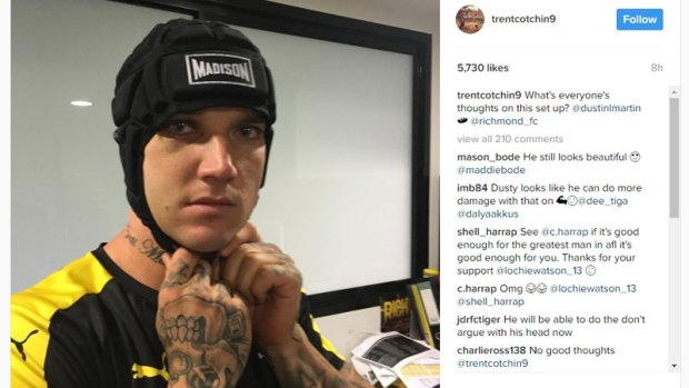 The Tigers' Dustin Martin tries out a helmet this week after suffering a fractured cheekbone last round. 