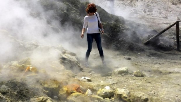 A visitor near a steaming fumarola at the Solfatara crater bed earlier this year.