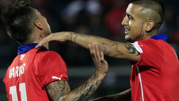 Arturo Vidal, right: set to miss the clash with the Socceroos.