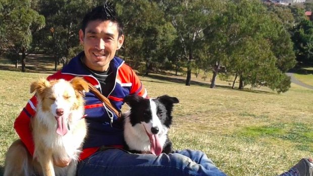 Trainer Dai Aoki with his dogs, Holly and Ace.
