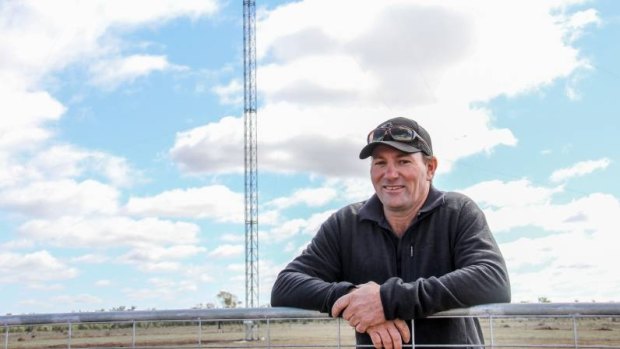 Queensland farmer Andrew Sevil with his 53-metre tower.