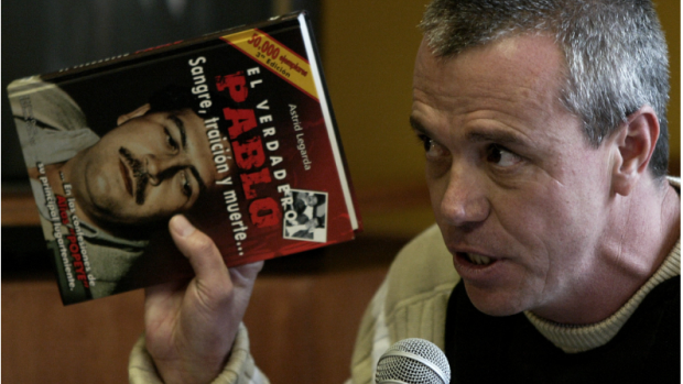 Velásquez testified while holding a book titled 'The True Pablo: Blood, Treason and Death' during a trial in Bogotá, Colombia, in 2006.