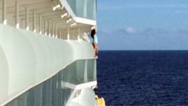 An unidentified woman was spotted posing on the edge of the ship in a swimsuit while travelling through the Caribbean. 