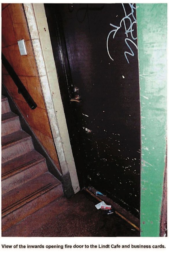 A photograph shows the business cards scrawled with notes that Jarrod Morton-Hoffman secretly pushed under the cafe back door for police. 