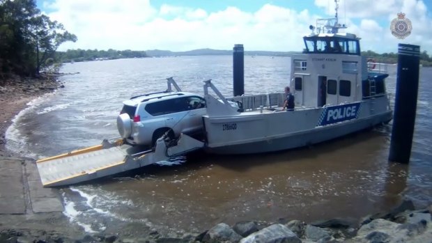 Police board a ferry for Macleay Island home.