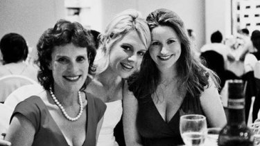 Dr Strydom (centre) at her wedding with her best friend, Carly Moulang (right). 
