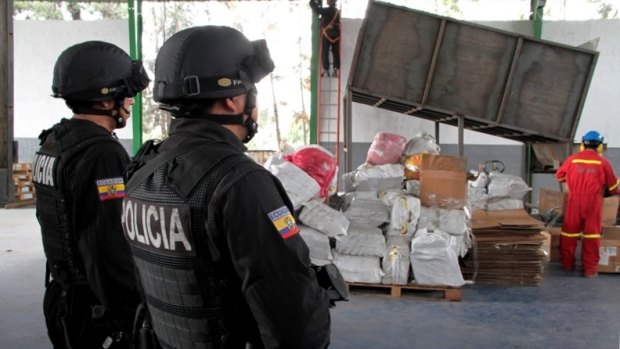 Ecuadorian police with cocaine seized in February last year in Guayaquil.