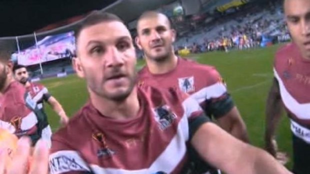 'Did I bite myself?: Robbie Farah protests to the referee.