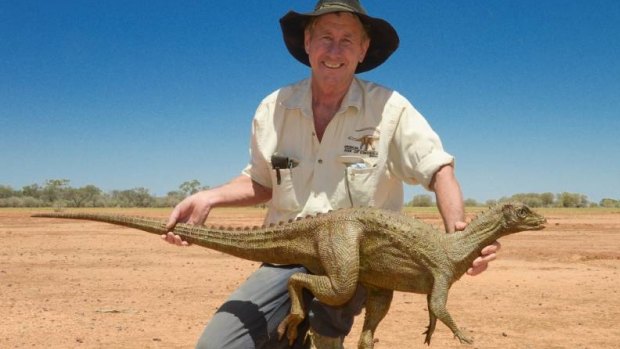 Australian Age of Dinosaurs founder David Elliott holding one of the lifesize dinosaur replicas just arrived from the US.