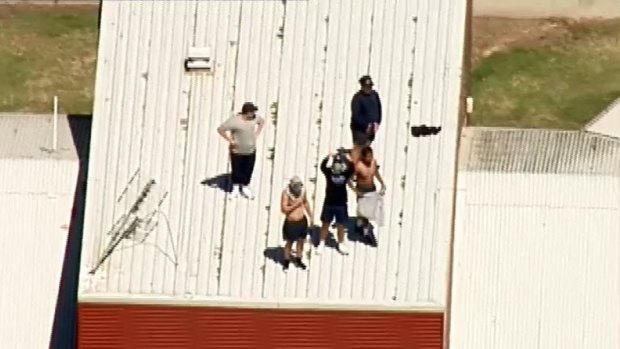 Youths on the roof of the Malmsbury centre during the January 25 riot. 
