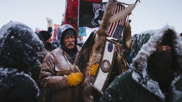 Glenn Scott, 60, a member of the Chippewa tribe and an army veteran, in amarch by more than  2000 veterans from the Oceti Sakowin Camp to the police roadblock on Backwater Bridge. 