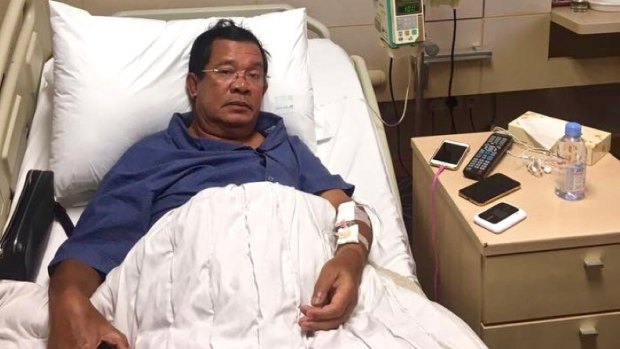 Hun Sen lies in a hospital bed in Singapore in May where he said he was treated for "extreme exhaustion".