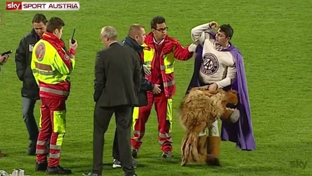 No thanks: Super Leo politely declines the assistance of security guards and paramedics.