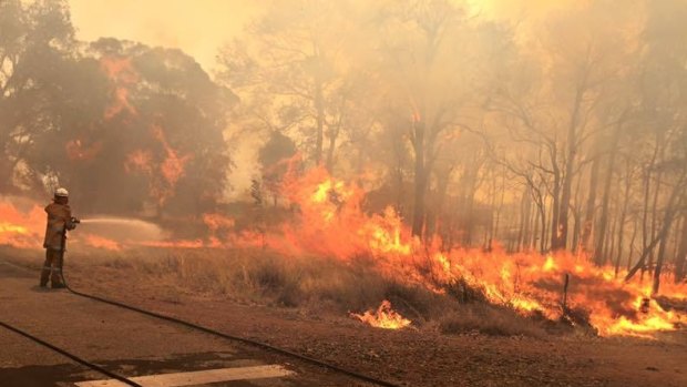 Firefighters fight to control the fires south of Perth.