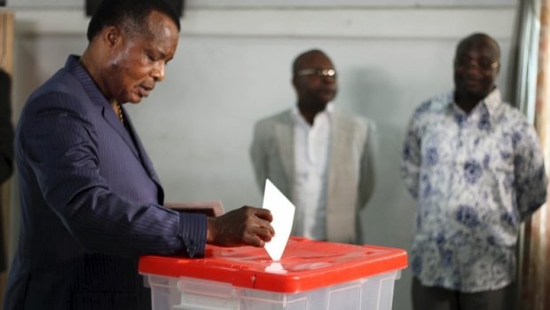 Republic of Congo President Denis Sassou Nguesso votes at a polling station in Brazzaville last year. 