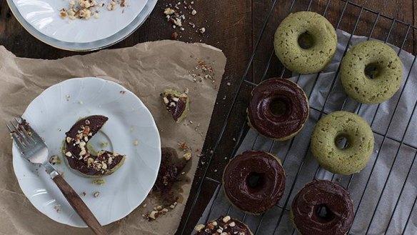 Vegan matcha doughnuts with chocolate ganache icing.