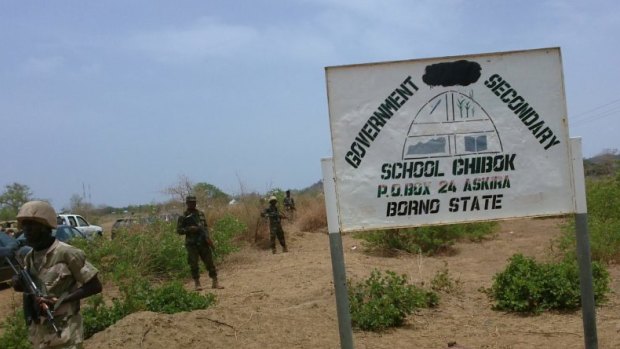 Soldiers stand guard the surroundings of the Government Girls Secondary School in Chibok in 2014.