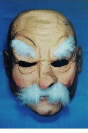 A rubber mask confiscated by police after an American man used a crossbow and tomahawk in an attack on a Central Coast man a week after arriving in Australia.