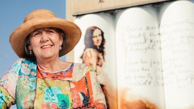 Philippa Murray, chair of the Dorothea Mackeller Memorial Society, in front of the new silo art mural dedicated to the poet in Gunnedah.