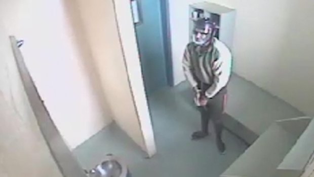 Queensland's Corrections Minister says the headgear put on a teenager in footage shown was a helmet to protect the boy.