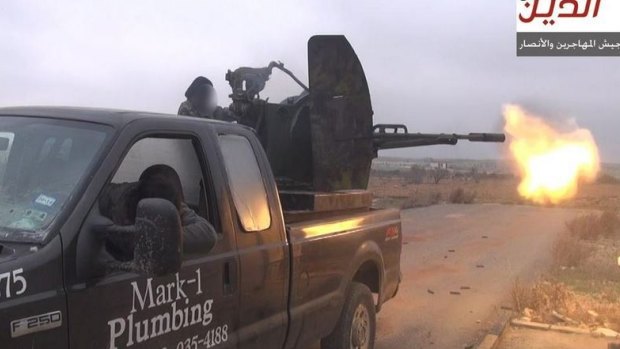 Texan Mark Oberholtzer's old work truck ... Jihadists from Ansar al-Deen Front fight Syrian goverment forces near Aleppo, Syria.