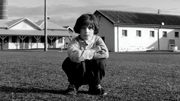 A Kosovar refugee child on the parade ground, Point Nepean quarantine station, 1999.
