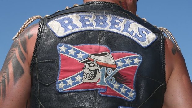 A Rebels bikie was charged with a string of drugs offences after police search his vehicle. 