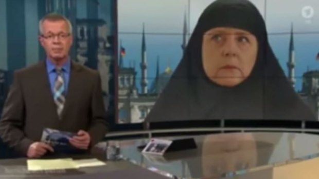 ARD's anchor hosting <i>Report from Berlin</i> with the "Muslim Merkel" montage in the background.