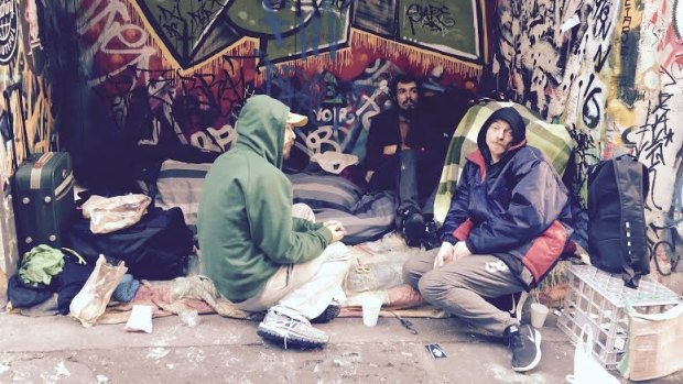 "We are homeless, not terrorists": Stuart Poden (pictured in blue) says of those who live in Hosier Lane. 