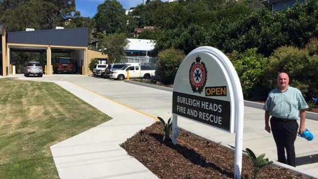 Note the "Open" sign as Member for Burleigh Michael Hart poses at the Burleigh Heads Fire and Rescue station.