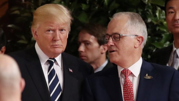 Prime Minister Malcolm Turnbull walks with US President Donald Trump at the G20.