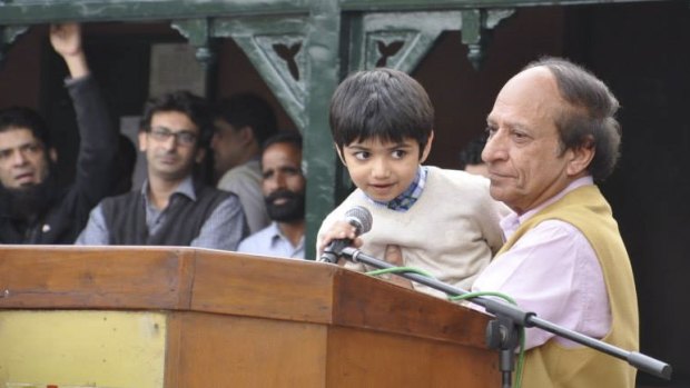 Sammy speaks: Sammy Sumbal, aged 8, son of Fayyaz Sumbal, a Pakistani police officer killed in a suicide bombing in 2013, thanks the crowd after the charity cricket game. 