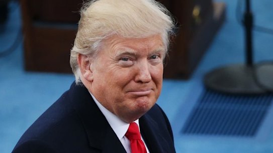 U.S. President-elect Donald Trump, left, stands on stage with U.S. Vice President Mike Pence during the 58th presidential inauguration in Washington, D.C., U.S., on Friday, Jan. 20, 2017. Donald Trump will become the 45th president of the United States today, in a celebration of American unity for a country that is anything but unified. Photographer: Daniel Acker/Bloomberg