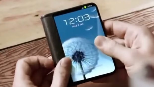 A Samsung concept design video shows a foldable device with a screen on the front and a larger screen, or dual screens, inside when unfolded.
