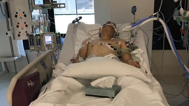 The Box Hill carjacking victim in his hospital bed.