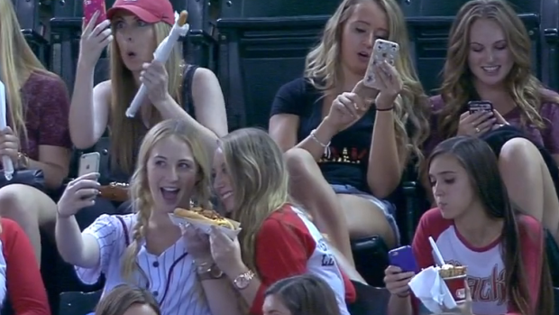 Mobile madness: Girls at the ol' ball game.