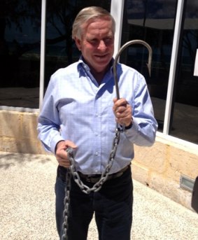 Premier Colin Barnett with  hooks used on drum lines to catch sharks in 2014.