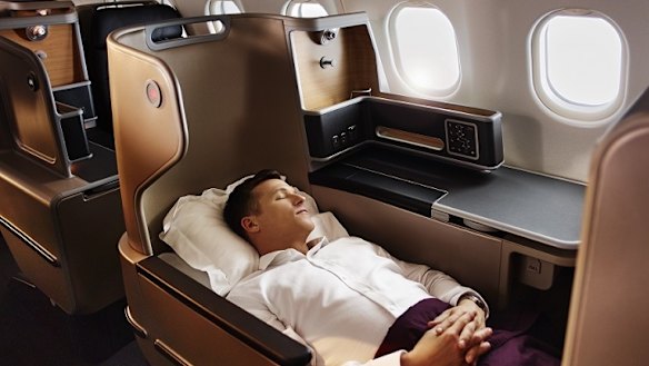 Reclining in a Qantas A330 business suite.