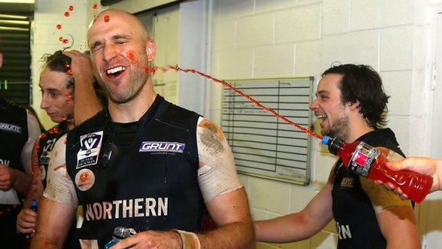 Former AFL star Chris Judd is showered in Powerade.