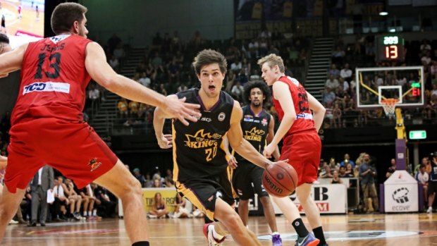 Rookie on the run: Kings guard Indiana Faithfull takes on the Perth defence.
