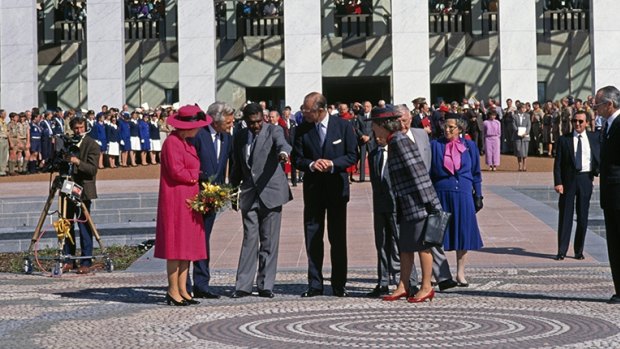 Queen Elizabeth II, Prime Minister Bob Hawke, artist Michael Nelson Jagamara and the Duke of Edinburgh at the official opening of new Parliament House, Canberra, 1988.
