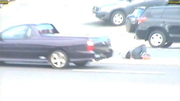 Police believe the driver of this dark-coloured Holden Commodore ute could have witnessed a collision between a man and a car in Fyshwick on Friday.