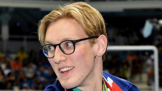 Mack Horton shows off his gold medal.